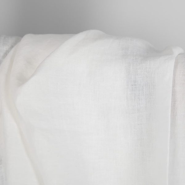 Washed linen fabric in off-white close up detail