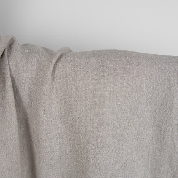 Washed linen fabric in natural grey close up detail