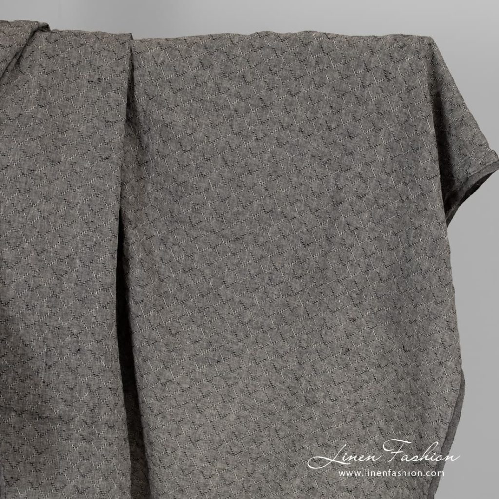 Black melange linen fabric with diamonds, washed.