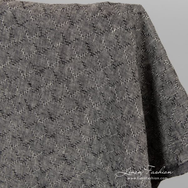 Washed linen fabric in black colour.