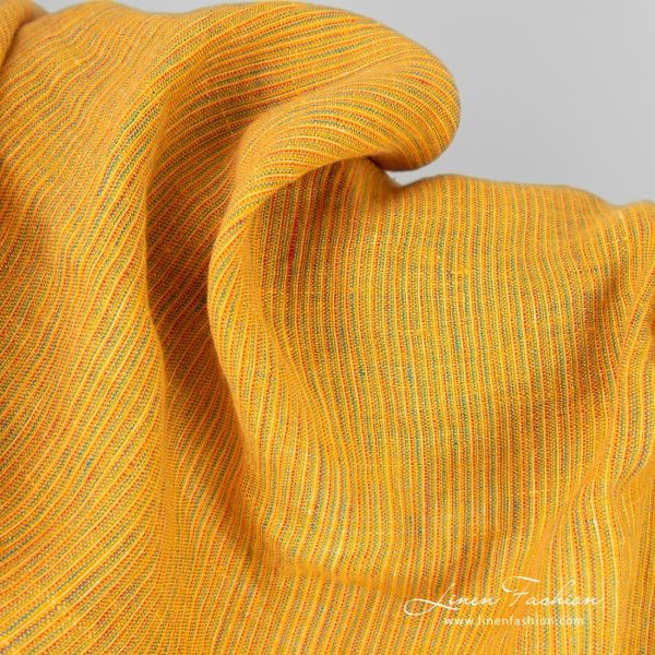 Yellow linen fabric in narrow stripes
