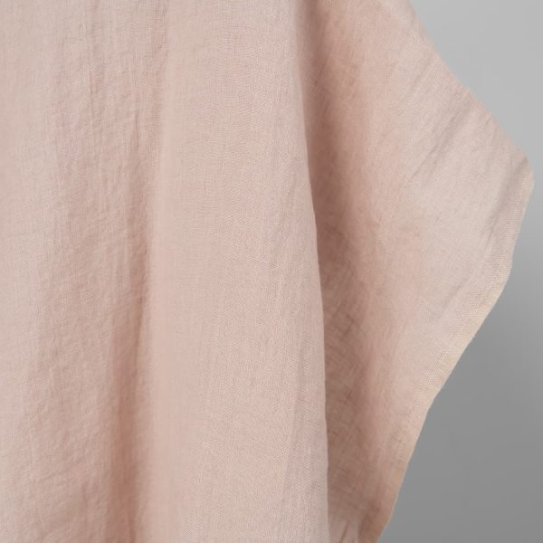 Washed linen fabric in light pink, fabric edge