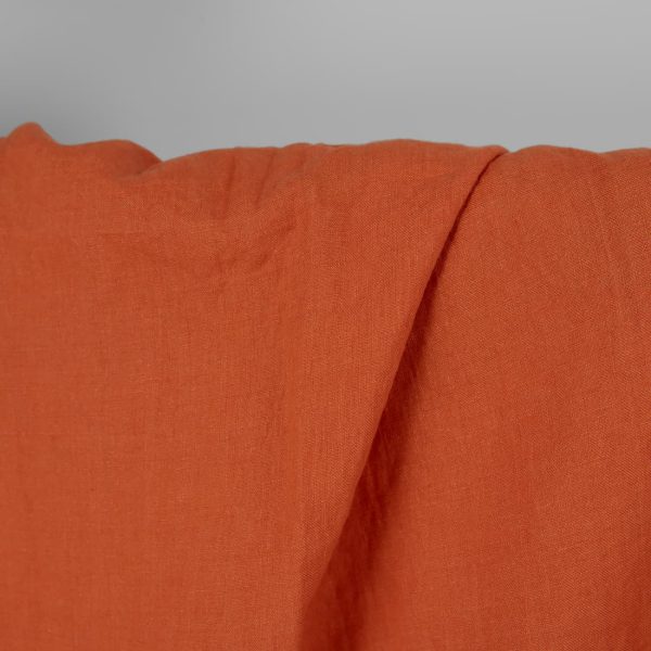 Washed linen fabric in dark orange, 100% linen