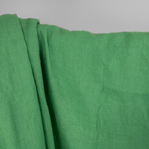 Washed linen fabric in spinach green, plain weave