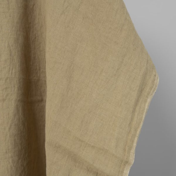 Washed linen fabric in greenish-beige, fabric edge