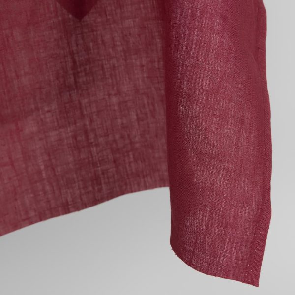 Linen fabric in dark cherry red colour edge