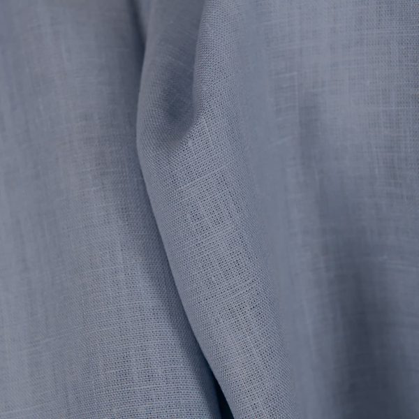 Linen fabric in plain greyish blue colour close up detail
