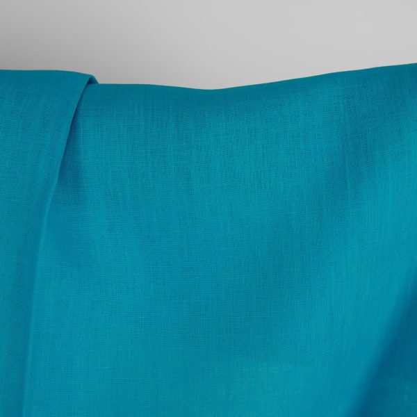 Linen fabric in vivid blue colour close up detail