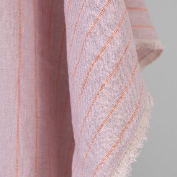 Washed linen fabric lilac with orange stripes, fabric edge