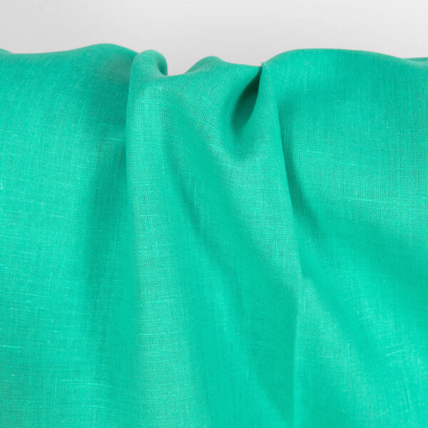 Pure linen fabric in green close up detail
