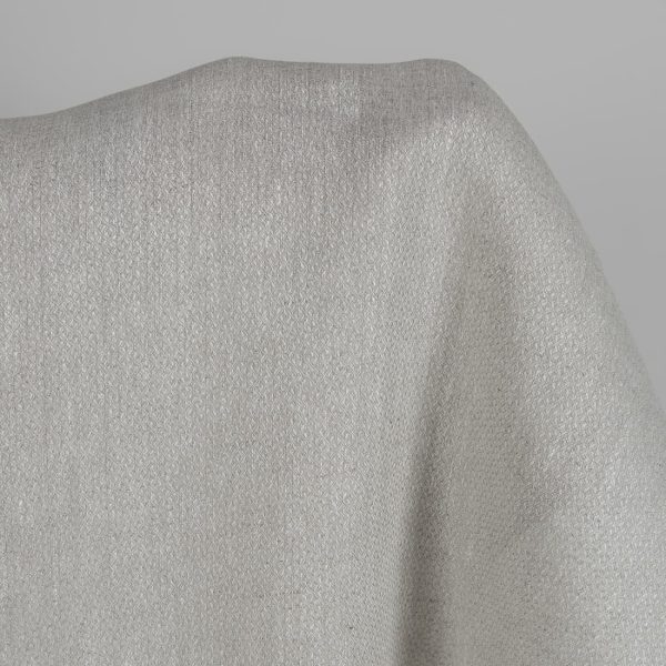 Beige linen fabric in a diamond pattern close up detail