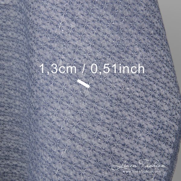 Linen fabric with small blue flowers