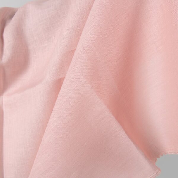 Linen fabric light pink colour close up detail view