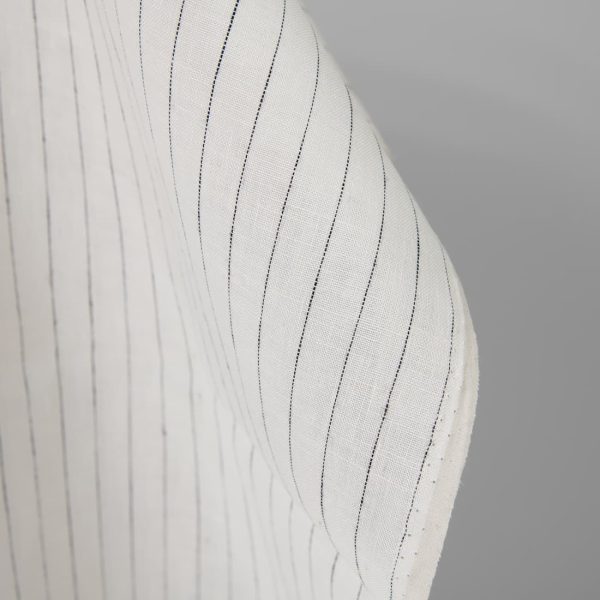 Linen fabric off-white colour with black stripes close up detail pinstripes