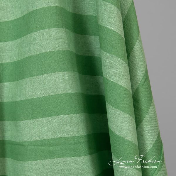 Wide striped green linen fabric.