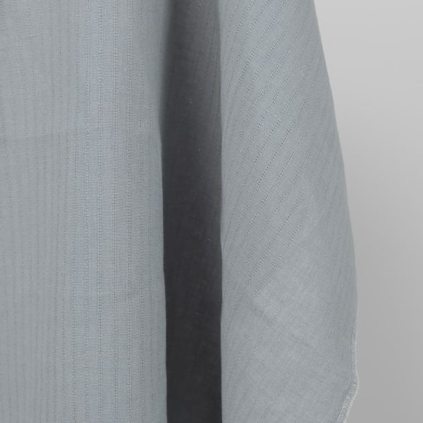 blue grey fabric with open stripes vertically.