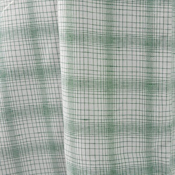 White linen cotton fabric with striped green checks close view photo