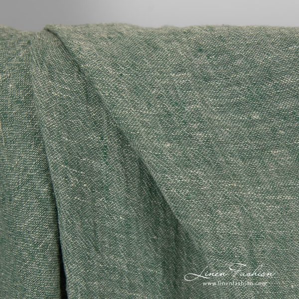 Transparent linen fabric in green colour.
