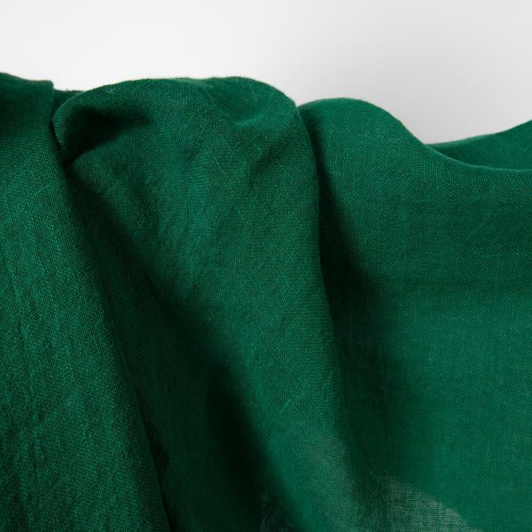 Washed linen fabric emerald green transparent close up detail view