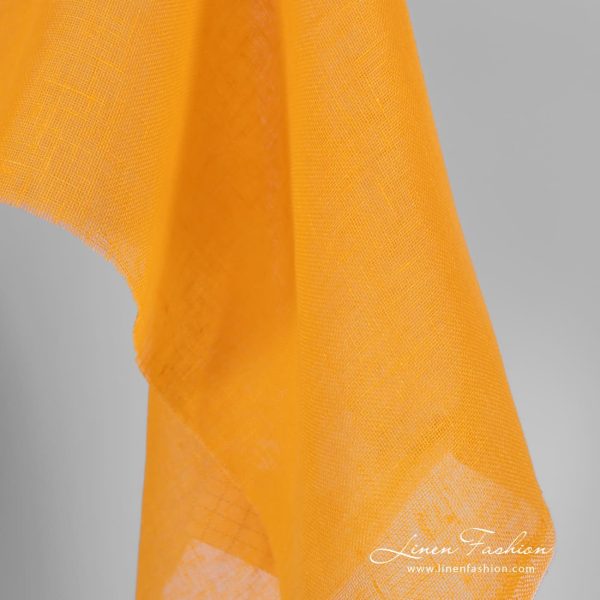 Linen fabric in yellow and orange colors, transparent