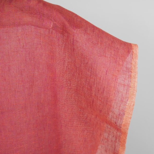 Transparent linen fabric in red close up detail