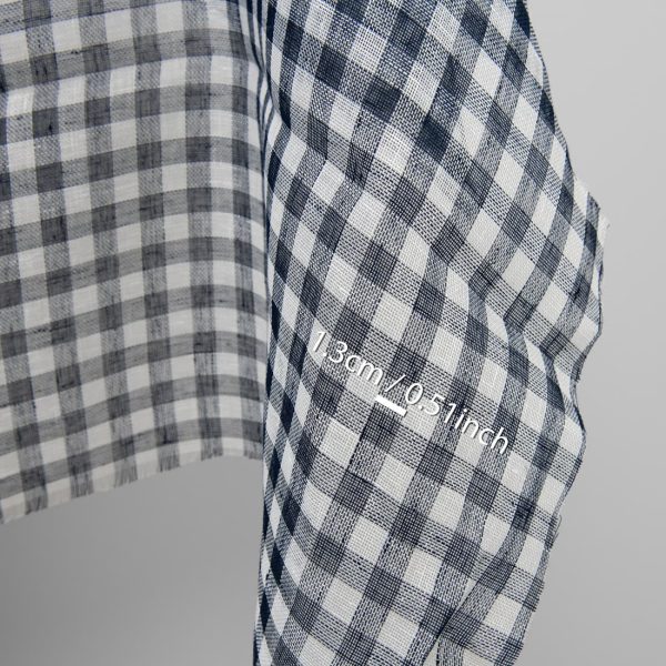 Linen fabric in dark blue and white checks, with measurements