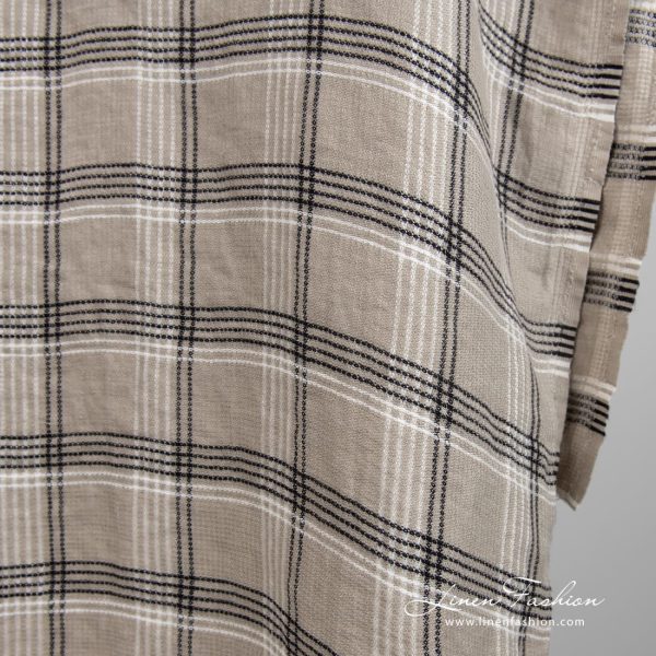 Grey brown linen fabric in checks, specially washed to increase softness