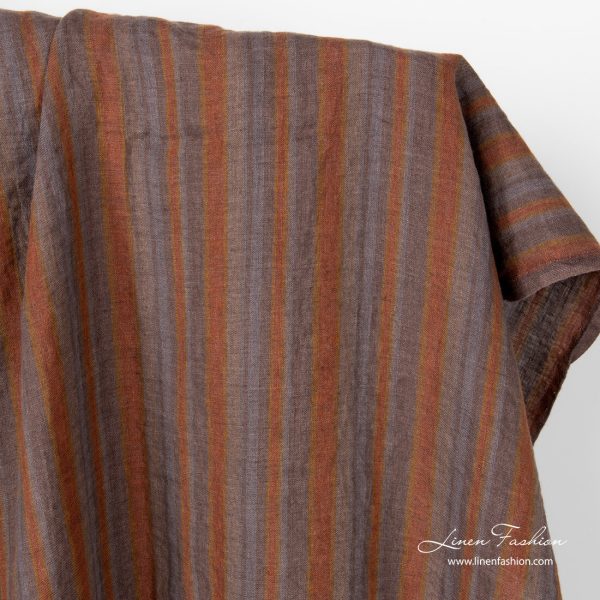 Linen fabric in brown grey vertical stripes, washed