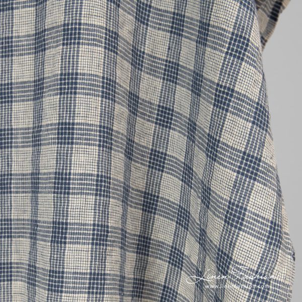 Washed cream colour linen fabric in checks.