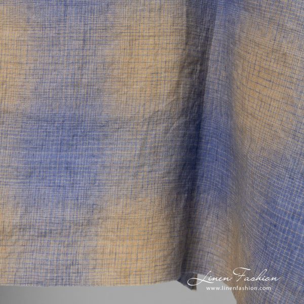 Checked linen fabric in blue and yellowish brown color, washed