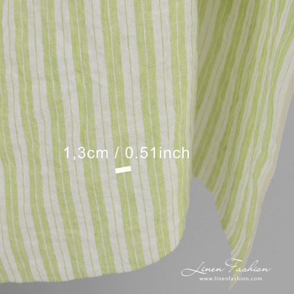 Light green linen fabric in stripes, perfect for clothes and home textile