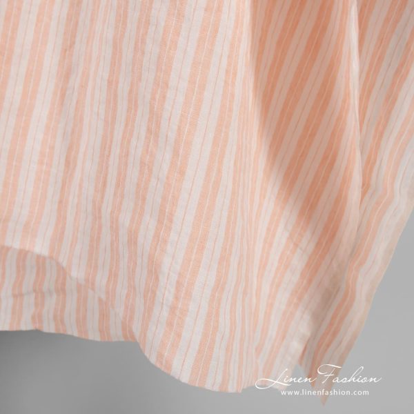 Striped linen fabric in peach color, specially washed to increase softness