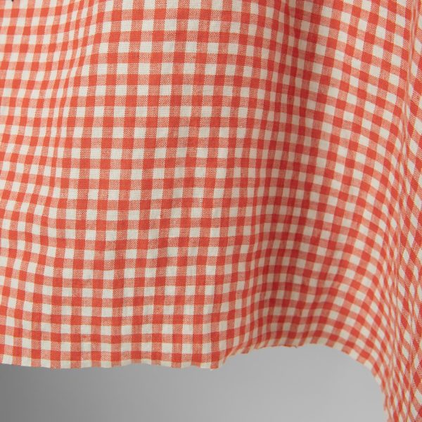 Washed linen fabric in red green checks edge photo