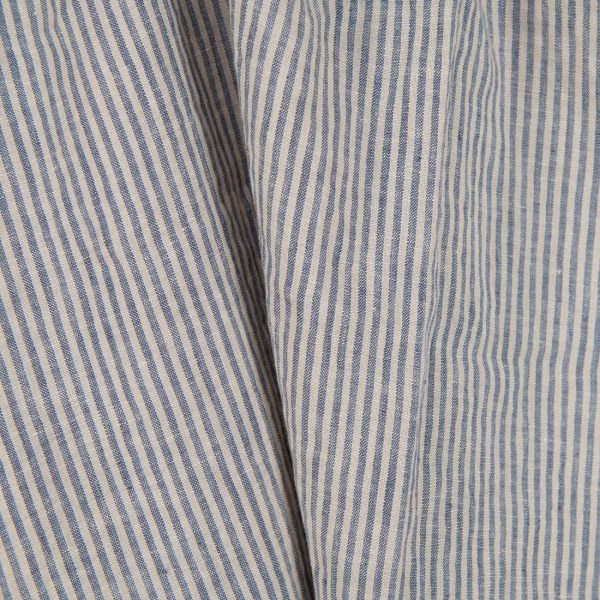 Washed linen fabric with brownish and blueish grey stripes close up view