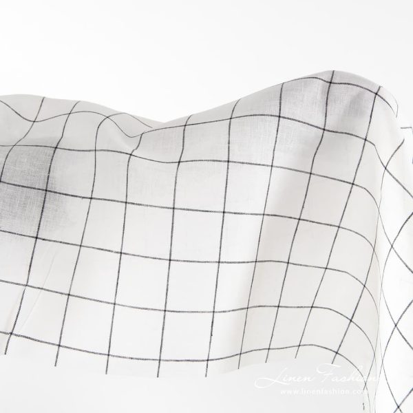 Off-white linen fabric with black grids.