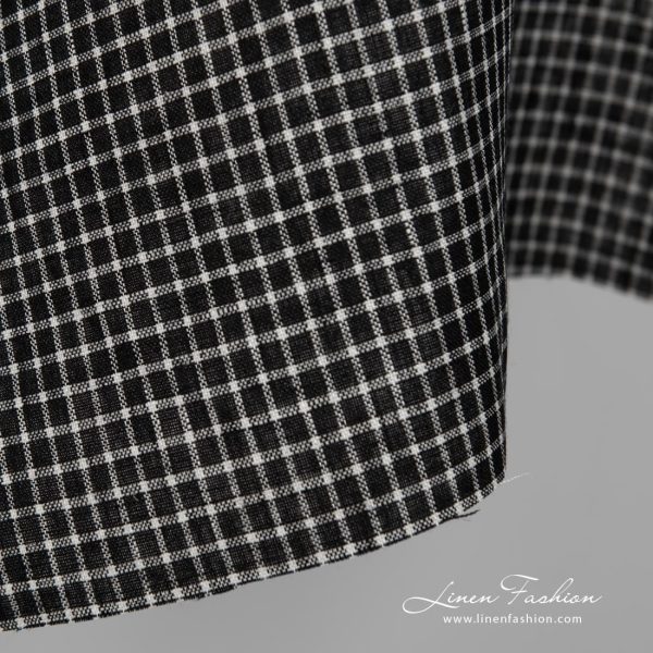 Black linen fabric with white checks close up detail view