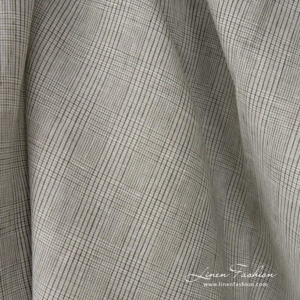 Linen fabric light beige with green checks close up detail