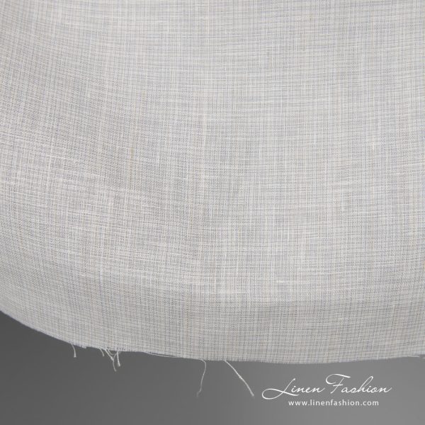 Wide linen fabric greyish white colour edge view