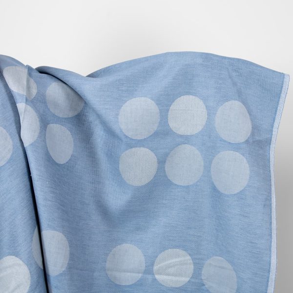 Linen cotton jacquard blue fabric with circles.