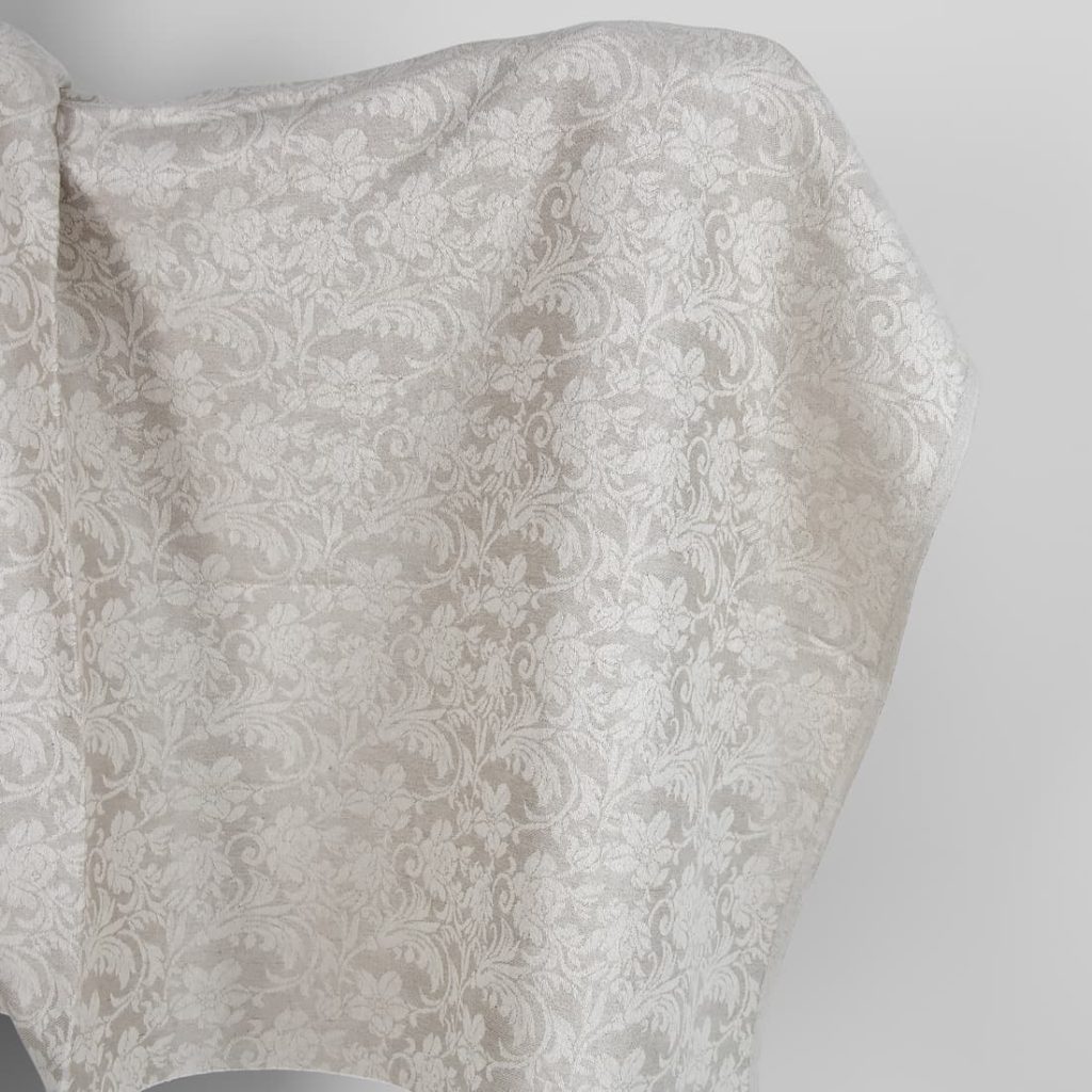 Undyed linen and white cotton fabric with flowers
