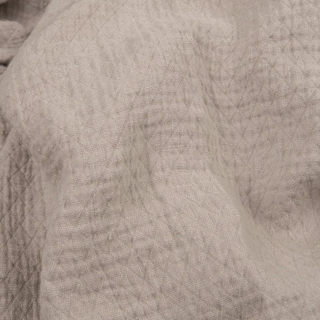 Light grey linen fabric with a diamond pattern washed