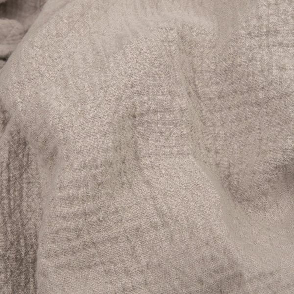 Light grey linen fabric with a diamond pattern washed