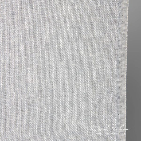Narrow linen fabric in white-grey melange close up photo