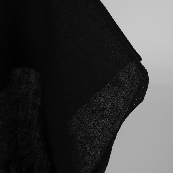Heavy linen fabric black colour close up edge view