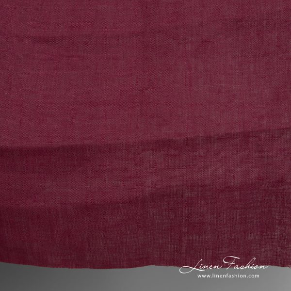 Linen fabric deep cherry colour close up detail