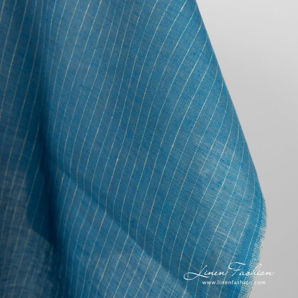 Linen fabric blue with yellowish stripes close up detail