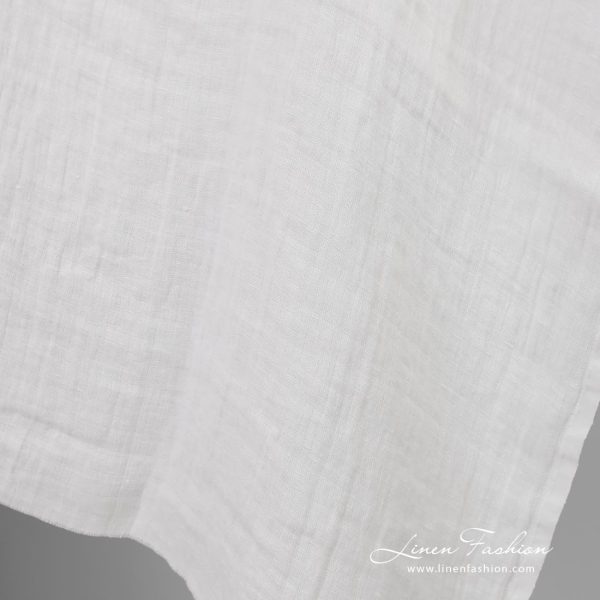 Off-white linen fabric in checks, washed