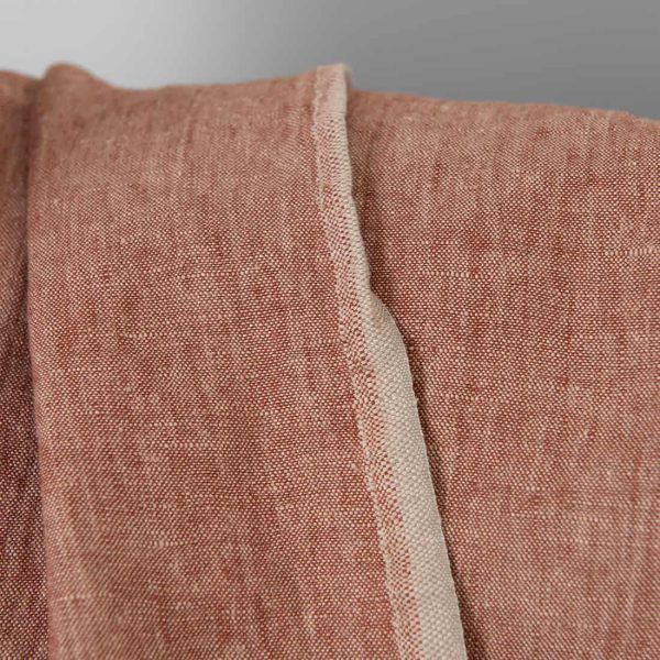 Washed linen fabric brick red with beige melange, fabric edge