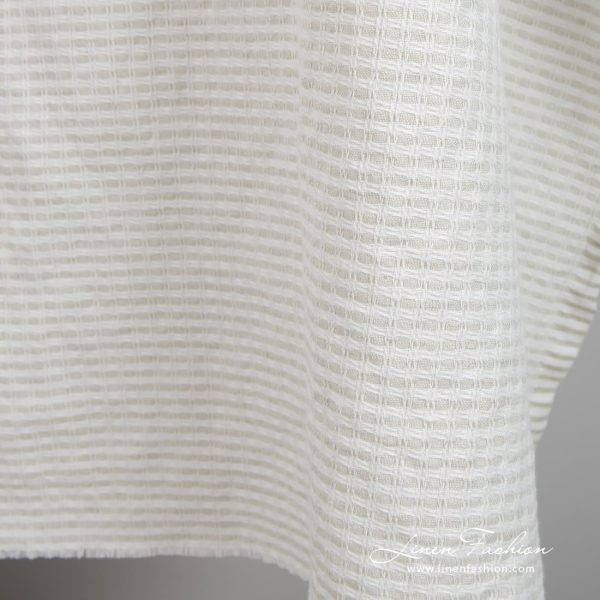 Light grey linen cotton fabric in checks, specially washed to increase softness