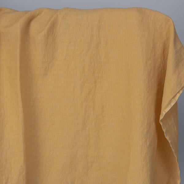 Washed linen cotton fabric in yellow-sand small pattern
